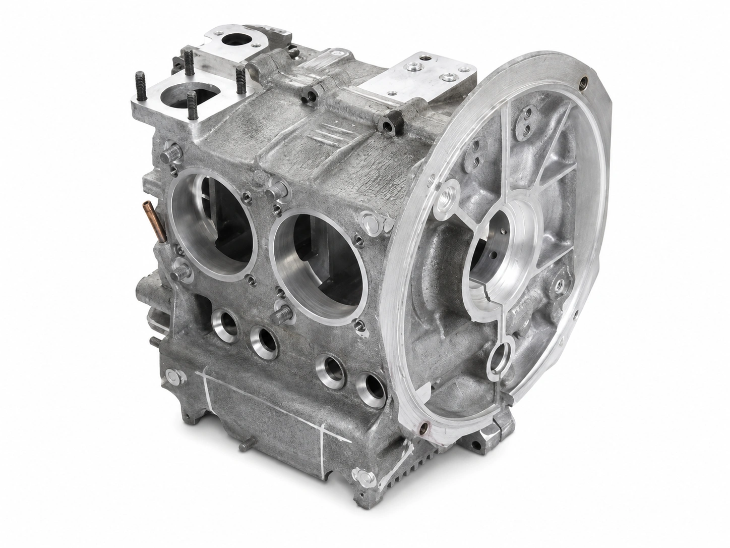 Magnesium automotive engine case with machined bores, reinforced ribs, and mounting surfaces